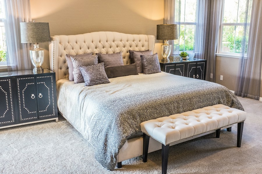 Soft neutral bedroom with layered bedding