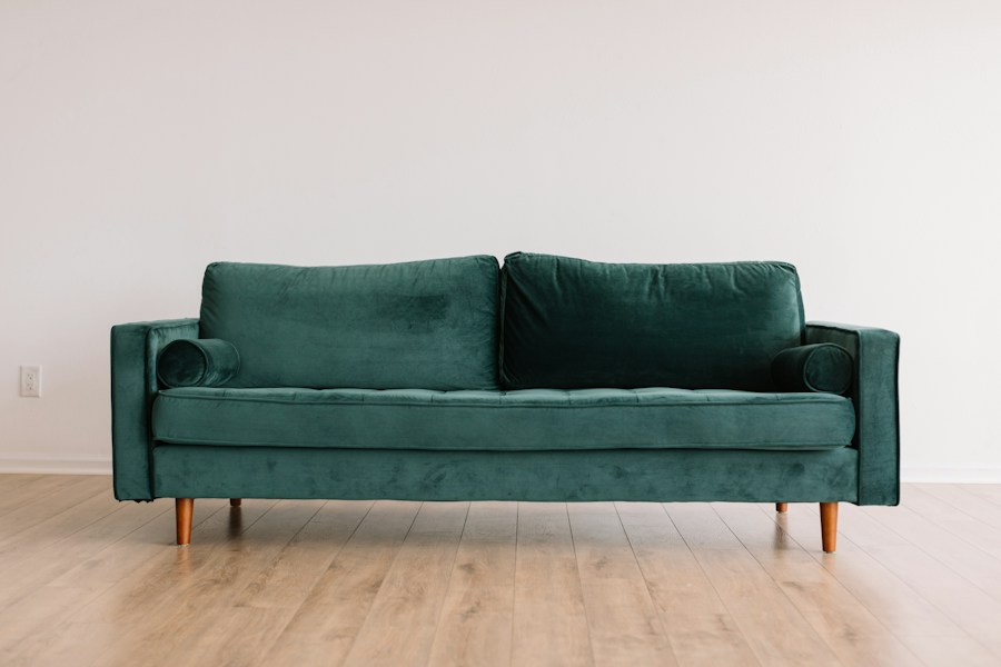 Warm living room with a green sofa